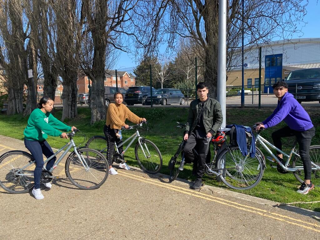 A group cycle ride through a London park